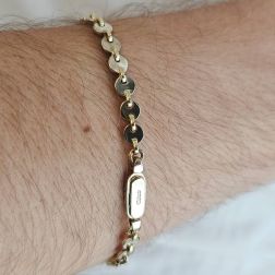 Photo of worn Disc sequin bracelet in white and yellow gold
