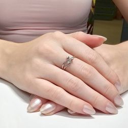 photo of worn three bands Trilogy Flower ring in White Gold and Diamonds