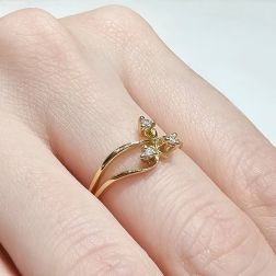 Photo of worn three bands Trilogy Flower ring in Yellow Gold and Diamonds