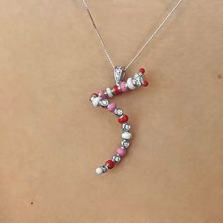 Photo of worn Caterpillar Pendant