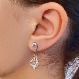 Photo of worn Rose and White with Diamonds and Rubies Gold Lily earrings