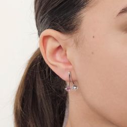 Photo of worn Double Flowers earrings with rubies and diamonds