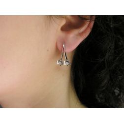 Photo of worn Double Flowers earrings with diamonds