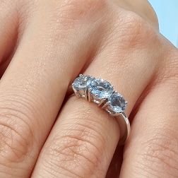 photo of worn Aquamarine Trilogy Ring in White Gold