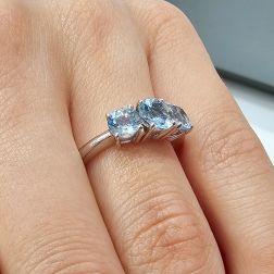 photo of worn Aquamarine Trilogy Ring in White Gold