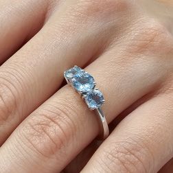 photo of worn Aquamarine Trilogy Ring in White Gold