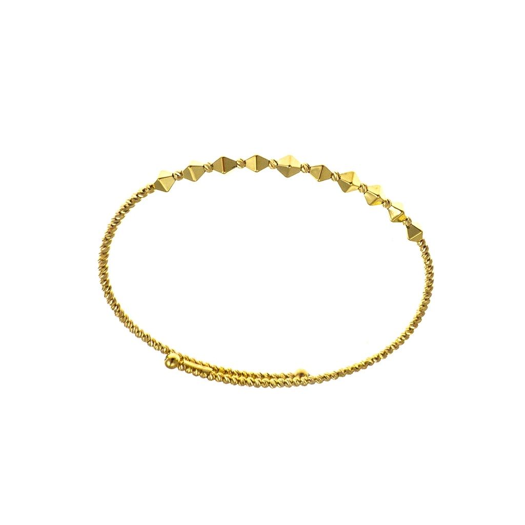 Open bangle bracelet with balls and three-dimensional rhombuses in yellow gold