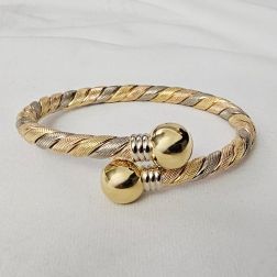 Rigid bracelet spiral with 2 spheres in yellow, white and rose gold