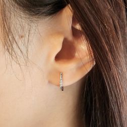 Photo of worn Small SINGLE Earring Small Oval Hoop Trilogy Diamonds