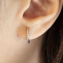 Photo of worn Small SINGLE Earring Small Oval Hoop Trilogy Diamonds