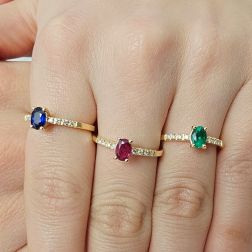 photo of worn Solitaire Rings with Oval Blue Sapphire, Emerald and Ruby and 8 Diamond