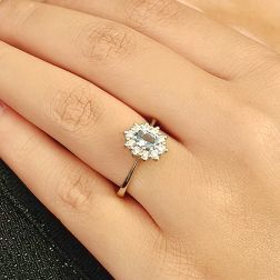 Photo of worn Kate ring with 6x4mm Acquamarine and 10 Diamonds