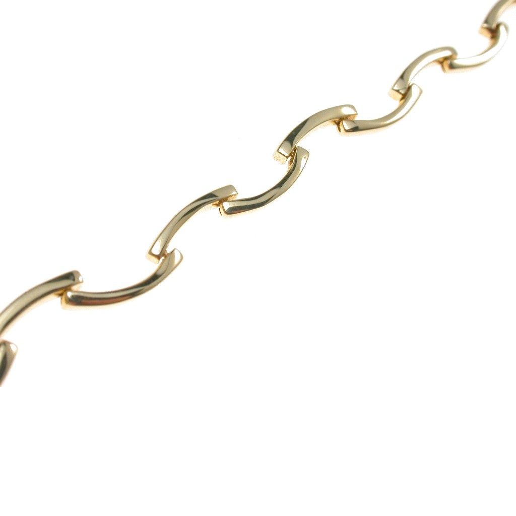 Semi-rigid bracelet with sinuous segments in yellow gold