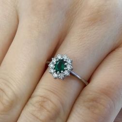 Photo of worn 5x4 Oval Emerald Solitaire Ring with 10 Diamonds