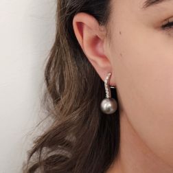 Photo of worn Tennis-style earrings with 14 diamonds and 13mm Tahiti pearls