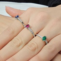 Photo of worn Oval Emerald Solitaire Ring with 8 Diamonds in White Gold