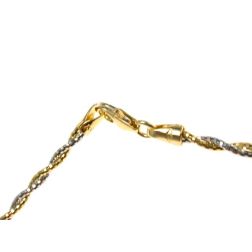 Semirigid flexible intertwined faceted necklace in yellow and white gold