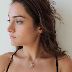 Photo of worn Starfish Earrings with Rhodolites, Yellow Topaz, Mandarin and Yellow Sapphires on Rose Gold