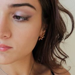 Photo of worn Starfish Earrings with Rhodolites, Yellow Topaz, Mandarin and Yellow Sapphires on Rose Gold