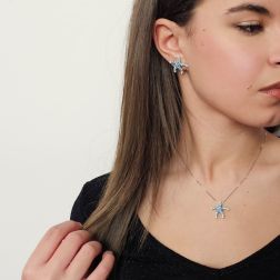 Photo of worn Starfish Earrings with Blue Diamonds in White Gold