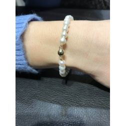 photo of worn Pearls Bracelet with Yellow gold Sphere