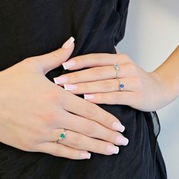 Photo of worn 6x4mm Oval Aquamarine Solitaire Ring with 6 Diamonds in White Gold