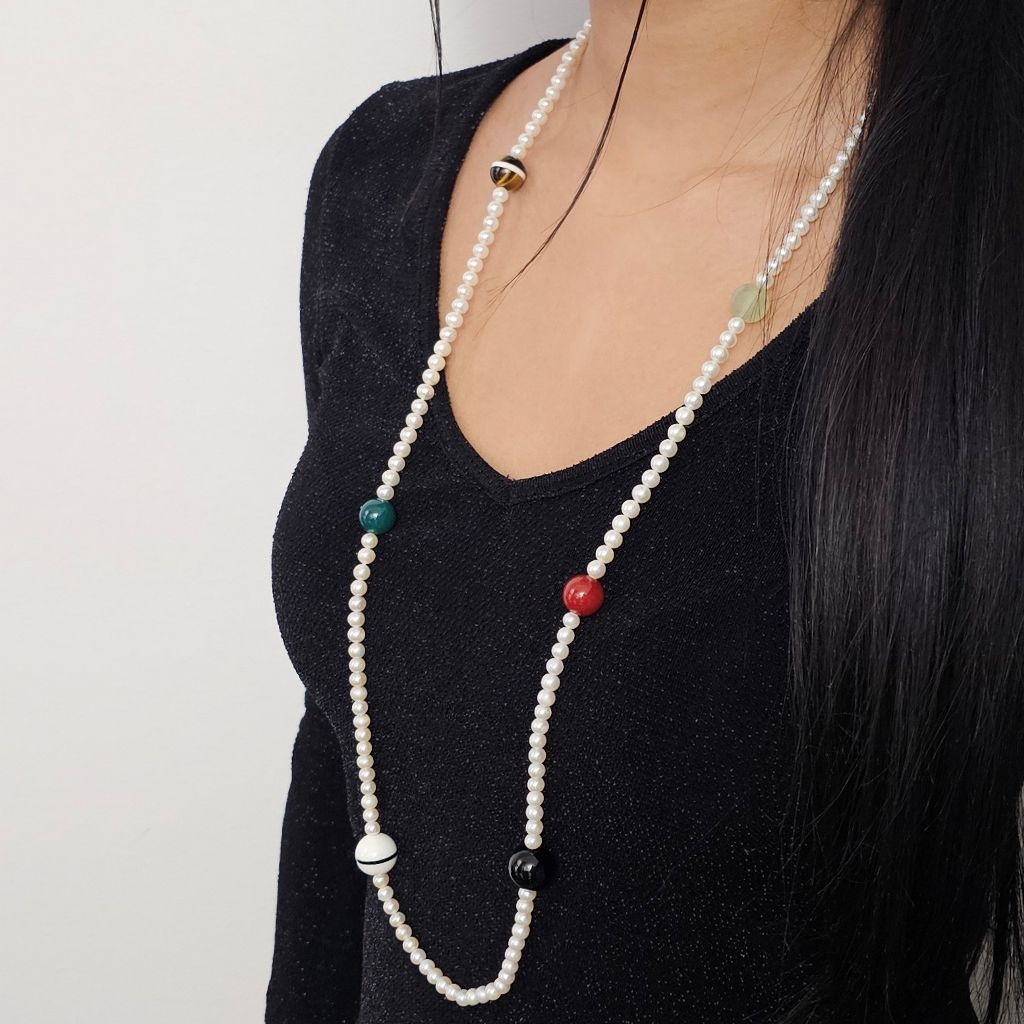 photo of worn 91cm long necklace with white pearls and multicolored stones, without clasp