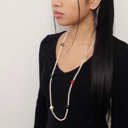 photo of worn 91cm long necklace with white pearls and multicolored stones, without clasp