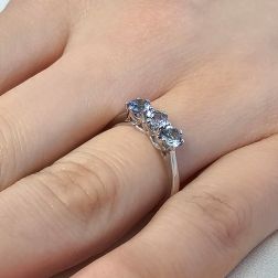 Photo of worn Trilogy Cruise Ring 4mm Aquamarine in White Gold
