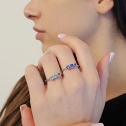 Photo of worn 4mm Tanzanite Trilogy Cruise Ring in White Gold