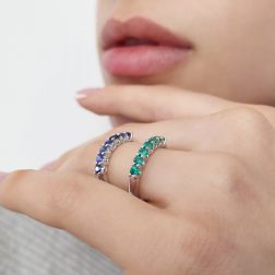 Photo of worn Veretta Ring with 7 Blue Sapphires Suspended in White Gold