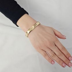 Photo of worn Large Square Rigid Bracelet in Polished Yellow Gold