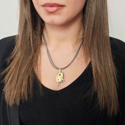 photo of worn Satin-finish Egg pendant in Yellow Gold and Diamonds