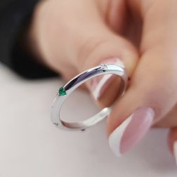 Photo of worn Thin pyramid-shaped ring with alternating diamonds, blue sapphires, rubies and emeralds