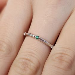 Photo of worn Thin pyramid-shaped ring with alternating diamonds, blue sapphires, rubies and emeralds