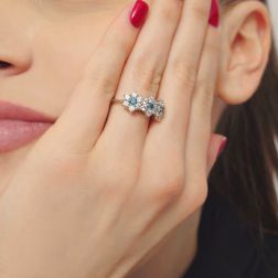 photo of worn  Trilogy Diamonds and Blue Diamonds Flower Ring