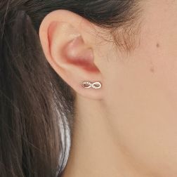 Photo of worn Infinity earrings in White Gold and zircons