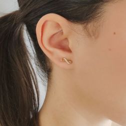 Photo of worn Infinity earrings in Yellow Gold and zircons