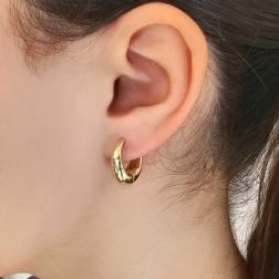 Photo of worn Yellow Gold Drop-Shaped Hoops