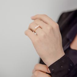 photo of worn Cross-Vault Trilogy Ring in Rose Gold with GIA certified Diamonds