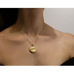 Photo of worn round photo holder charm