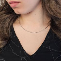 Photo of worn 1.50mm Tubular Semirigid flexible faceted necklace in white gold