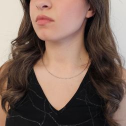 Photo of worn 1.50mm Tubular Semirigid flexible faceted necklace in white gold