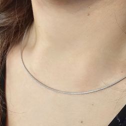 Photo of worn 1.30mm Tubular Semirigid flexible faceted necklace in white gold