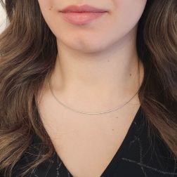 Photo of worn 1.30mm Tubular Semirigid flexible faceted necklace in white gold