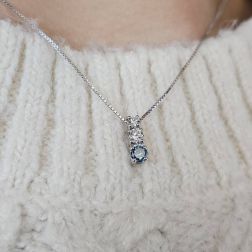 photo of worn Trilogy scalar necklace with Blue Diamond