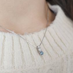 photo of worn Trilogy scalar necklace with Blue Diamond