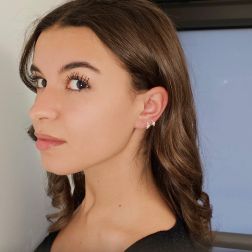 Photo of worn Star Earrings Mini Round Hoops with Diamonds on Yellow Gold