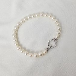 Bracciale Perle Fresh Water 6-6.50mm chiusura fiore Oro Bianco 18kt