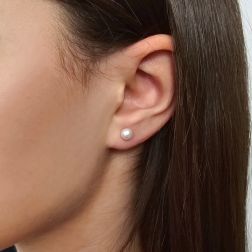 photo of worn Earrings with 5.5mm freshwater pearls in white gold